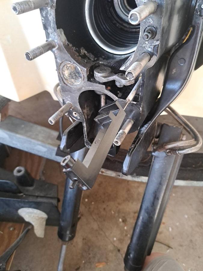 Sterndrive transom assembly with bellows and shift linkage exposed